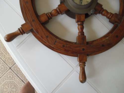 Center brass Porthole with clock working and wood ships wheel add to your order postnet postage R220