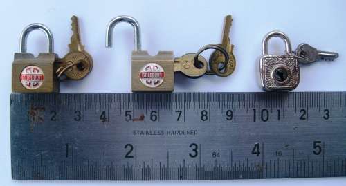 Collection of 11 miniature padlocks with keys