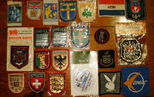 Lot of 22 embroidered cloth badges.