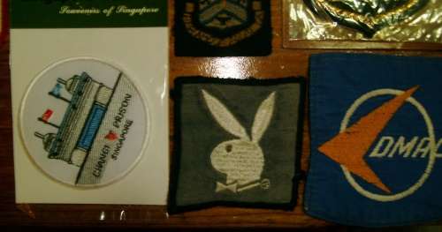 Lot of 22 embroidered cloth badges.