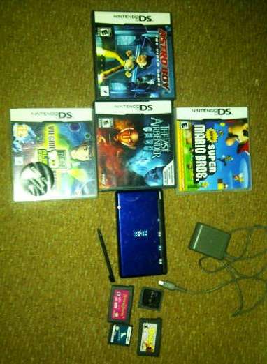 Nintendo DS with games and charger