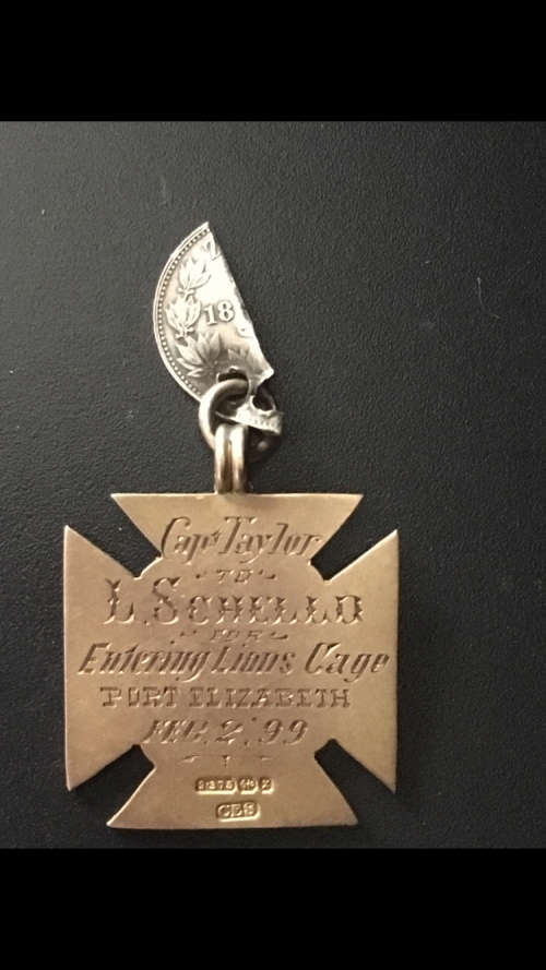 Gold Medal - Capt Taylor to L. Schello for Entering Lions Cage Port Elizabeth Feb.2 - 1899