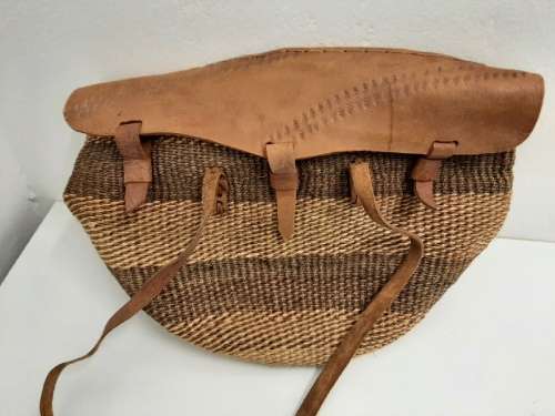Handbag with leather straps, etc.
