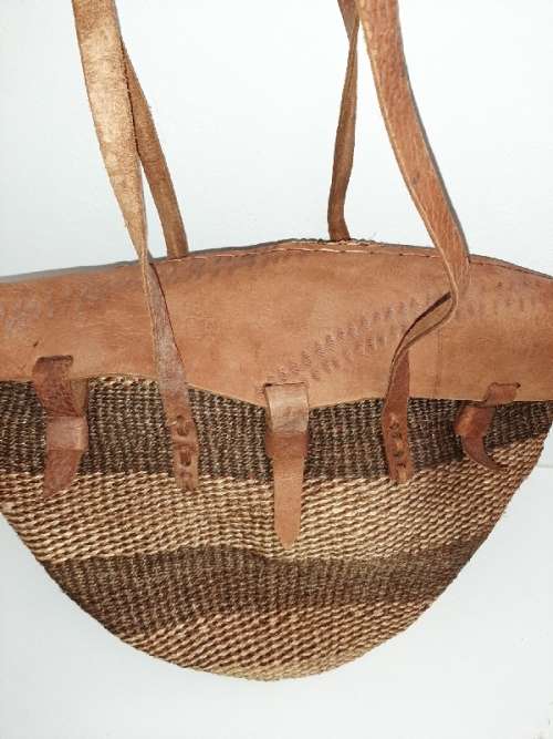 Handbag with leather straps, etc.