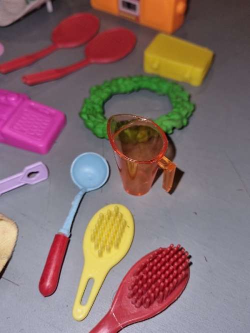 Barbie accessories including radios, rackets, curlers, belts, etc.