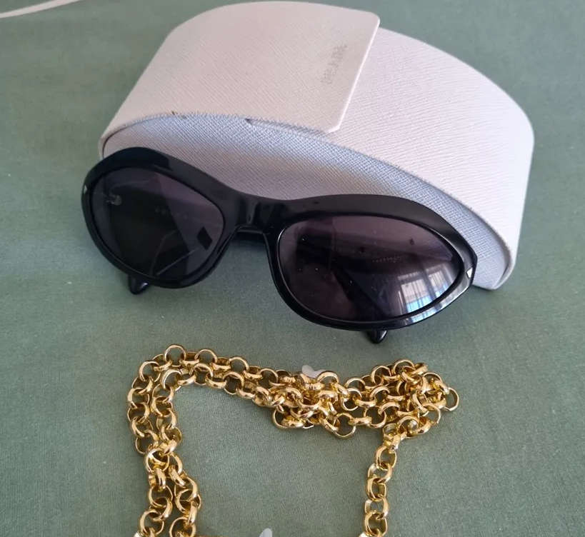 Gorgeous authentic cat eye Prada sunglasses for sale.