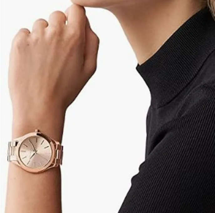 Gorgeous Michael Kors watches. Rose gold. Model number: MK - 3197.