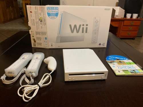Nintendo wii console with remotes and wii sports