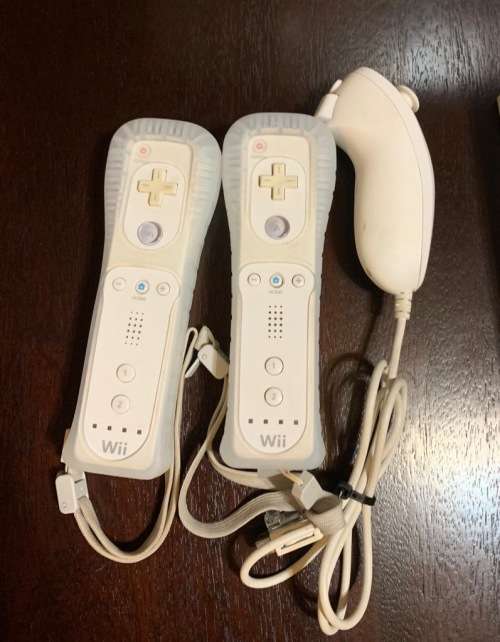 Nintendo wii console with remotes and wii sports