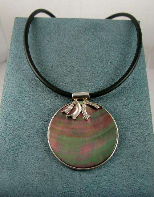 Beautiful Vintage Necklace with Mother of Pearl Pendant on Gum Elastic Cord. Sterling Silver