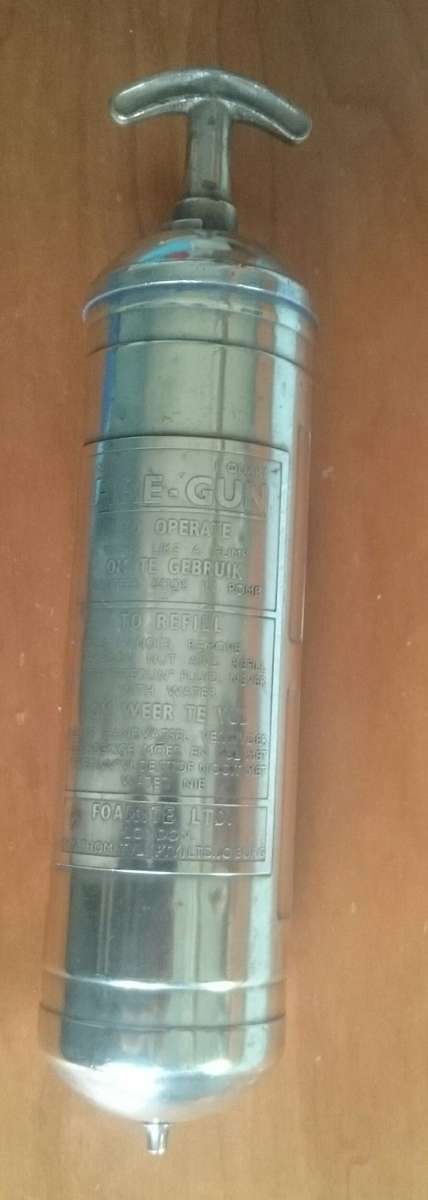 Antique brass 1956 fire extinguisher