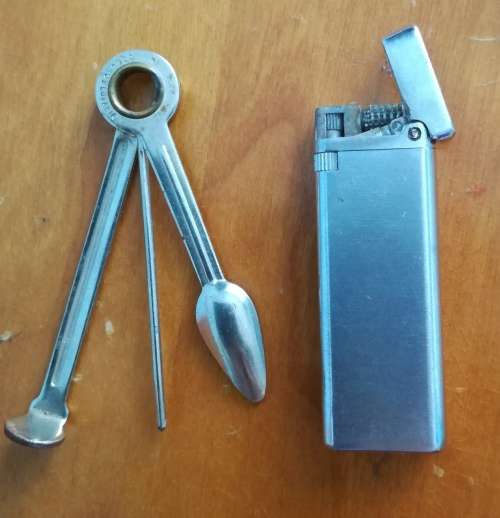Old Mazda lighter and pipe cleaner.