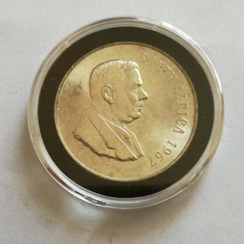 1967 ENGLISH CAPSULED SILVER ONE RAND.  GOOD CONDITION.