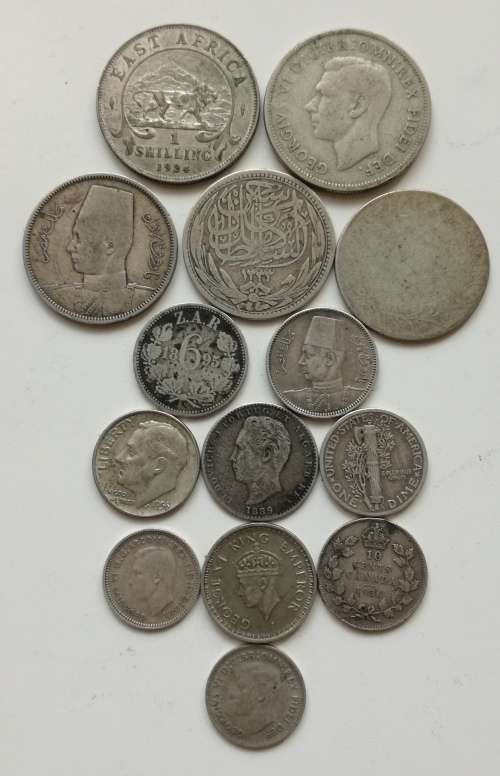 Collection of 14 silver coins from around the world. Some good.