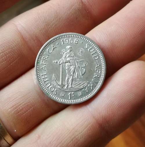 South Africa 1958 Silver Better grade Shilling.