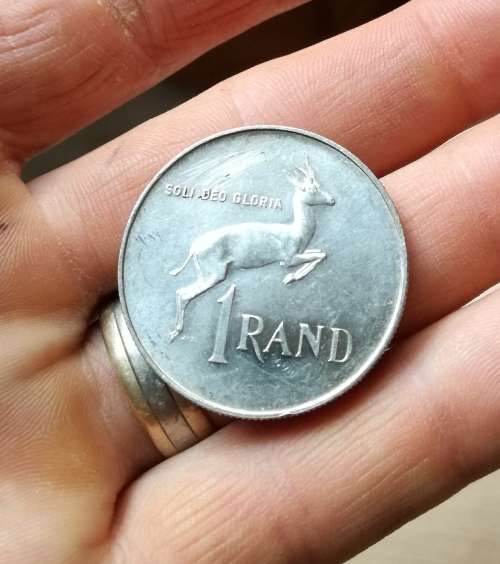 South Africa 1966 Afrikaans silver R1. Good condition.