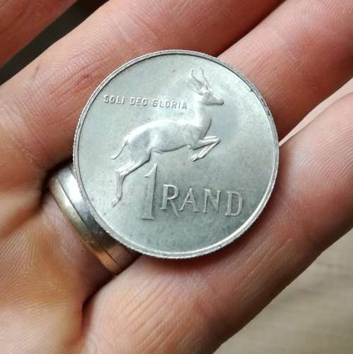 South Africa 1967 Afrikaans silver R1. Good condition.