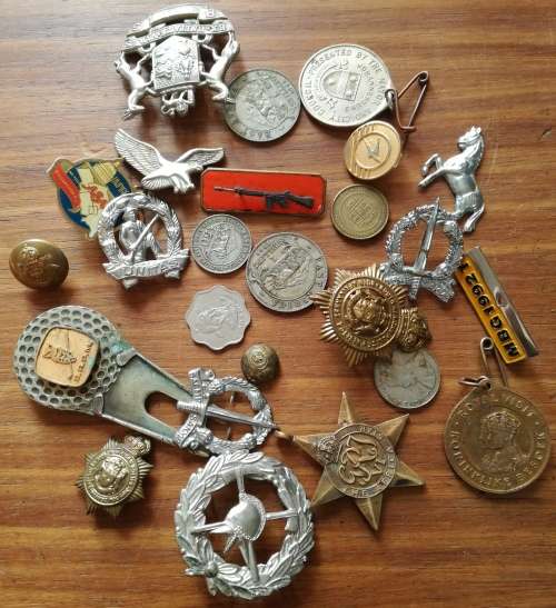 Mixed collection of coins, tokens and military items.