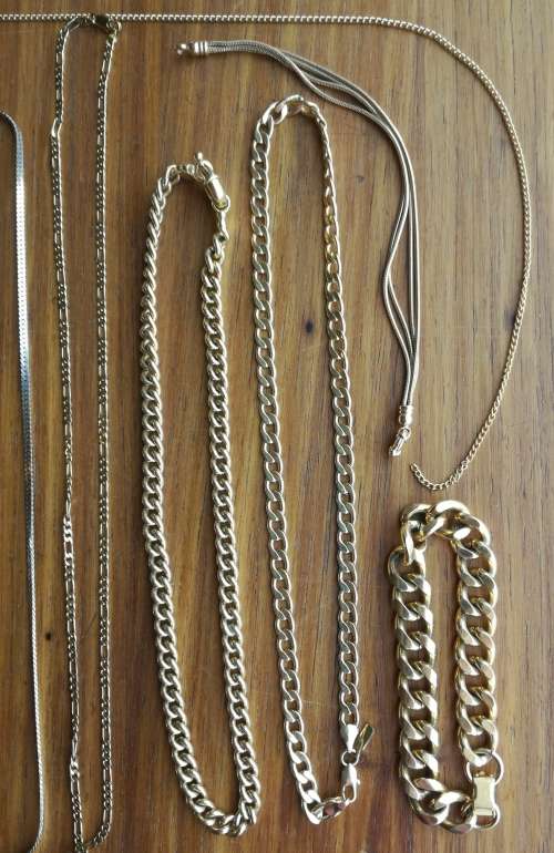 Large collection of 17 ladies and men`s necklaces and one ring.