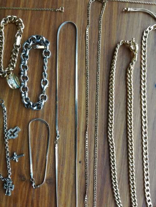 Large collection of 17 ladies and men`s necklaces and one ring.