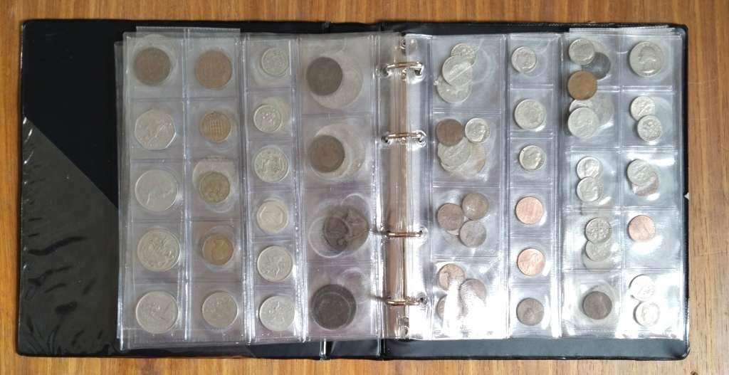 Collection of 113 old coins with album. Nice collection.