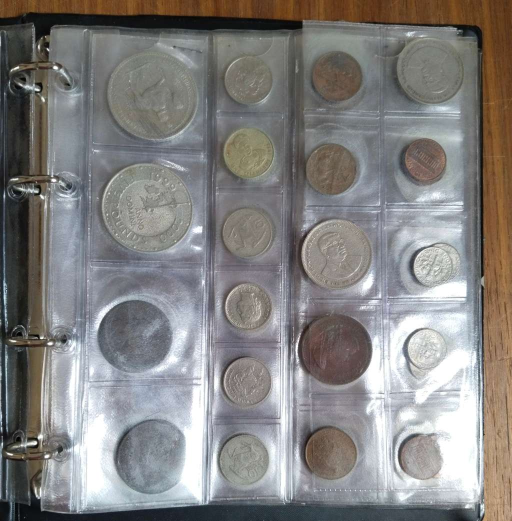 Collection of 113 old coins with album. Nice collection.