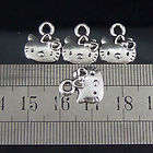 12 X Hello Kitty faces Tibetan silver charms