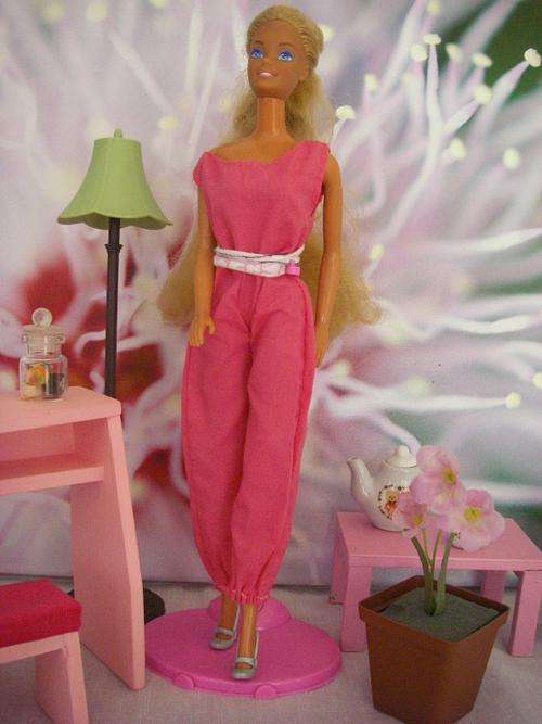 Mattel 1966 vintage Barbie doll with long hair in pink jumpsuit