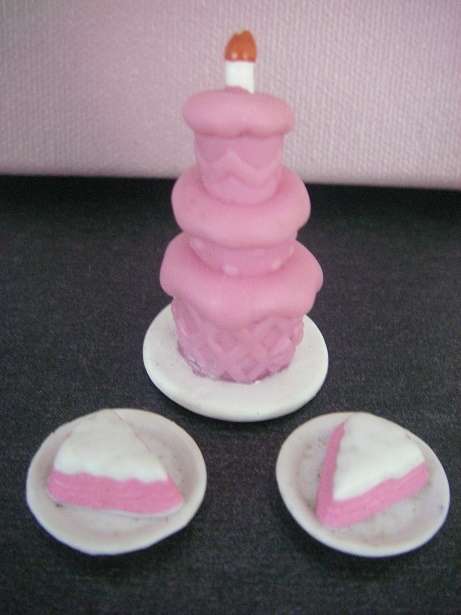 Barbie doll household accessories, pink layered cake with side plates