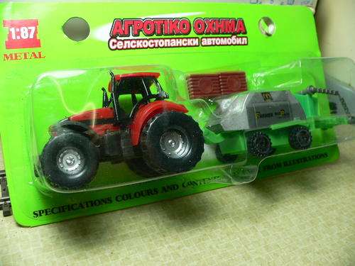 HO scale tractor with implement.