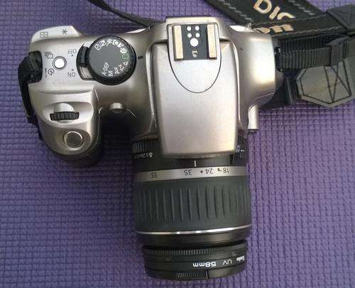 Canon D300 body with standard 18 to 55mm lens with extras. good cond..