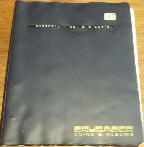 190 x 220  Plastic coin album with 6 pages & dividers & 158 S/Rhod,R&Nya,Rhodesia coins-listed below