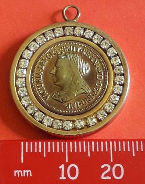 Pendant with unknown stones (not diamonds) and gold plated coin-plating worn off high spots of coin