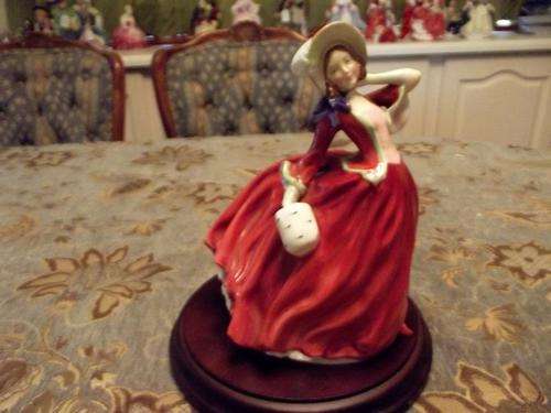 Royal Doulton Autum Breeze Figurine.In Immaculate condition.Made in England.HN1934.
