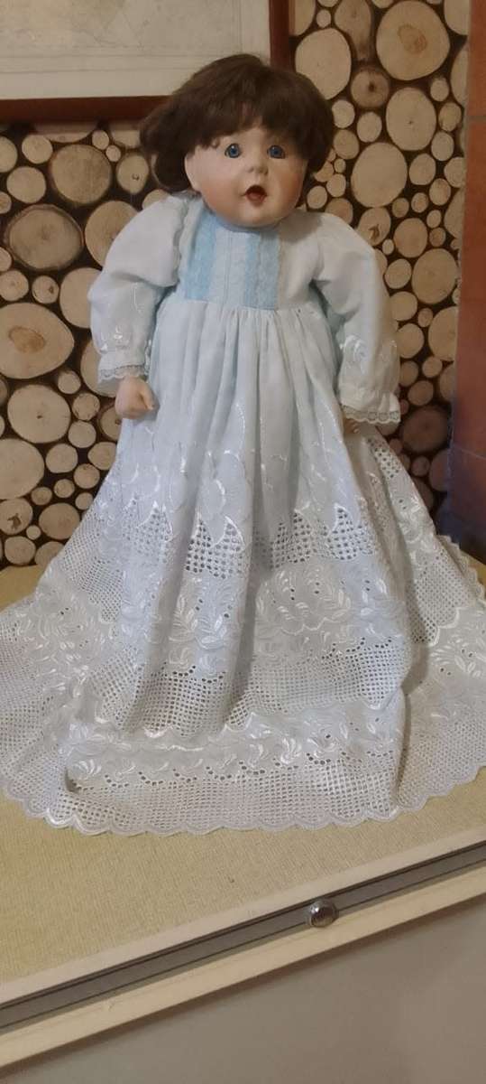 PORCELAIN DOLL - Christening Doll- 55 cm long - ON WOODEN STAND