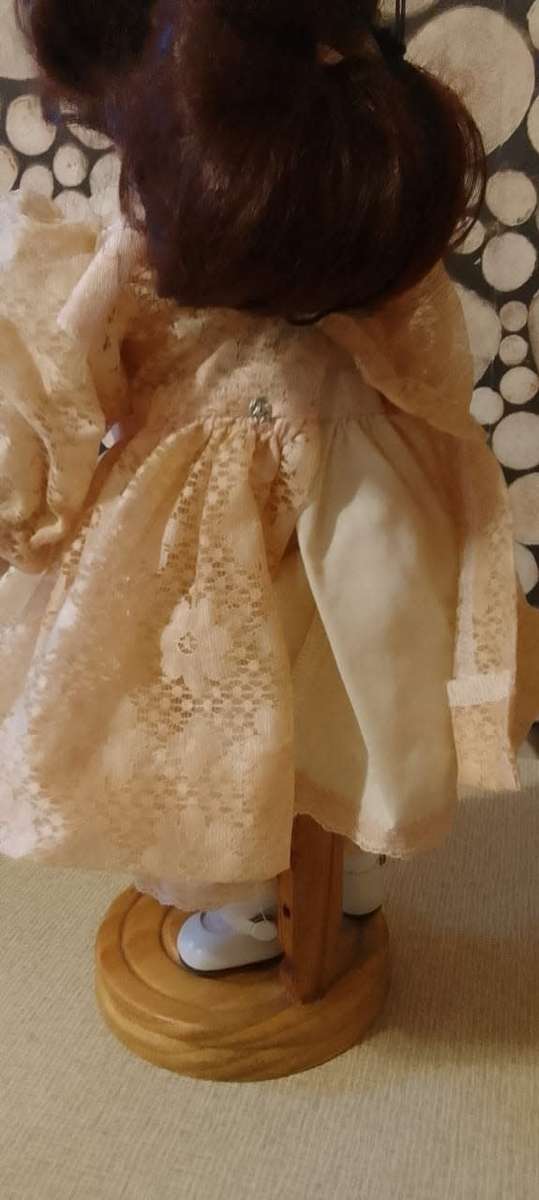 PORCELAIN DOLL - vintage- 40 cm long - ON WOODEN BASE