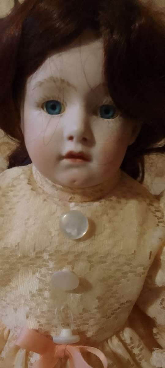 PORCELAIN DOLL - vintage- 40 cm long - ON WOODEN BASE