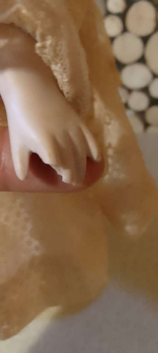 PORCELAIN DOLL - vintage- 40 cm long - ON WOODEN BASE