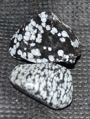 Polished and rough Snowflake Obsidian activates third eye, root and earth chakra