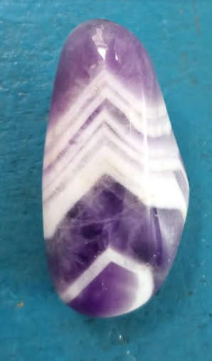 Polished Amethyst drown out negative energies, washing them clean.