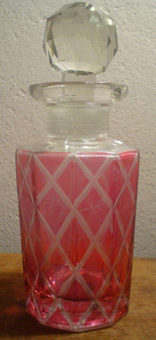 Pink glass bottle with lid