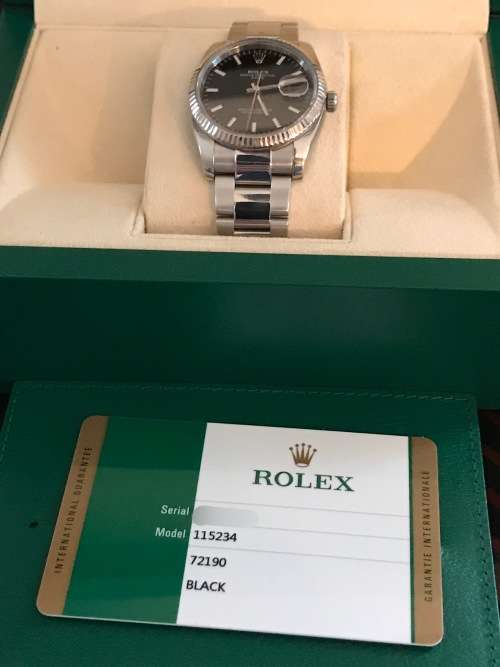 Rolex Oyster Perpetual Date Mens Watch 115234 34mm with 18ct white gold bezel [Box and Papers]