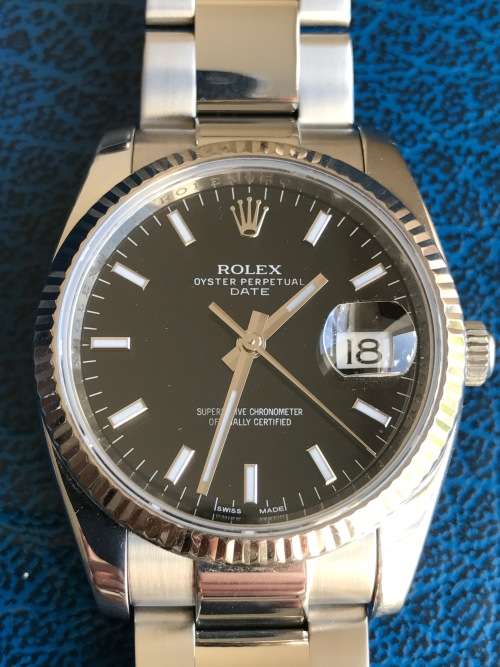 Rolex Oyster Perpetual Date Mens Watch 115234 34mm with 18ct white gold bezel [Box and Papers]