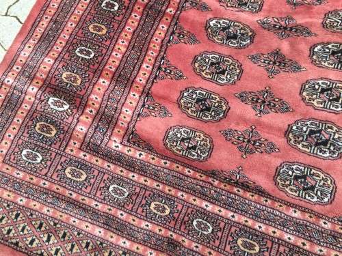 Large oriental rug including under-carpet