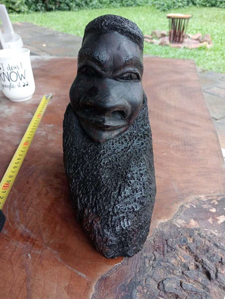 Wooden bearded head