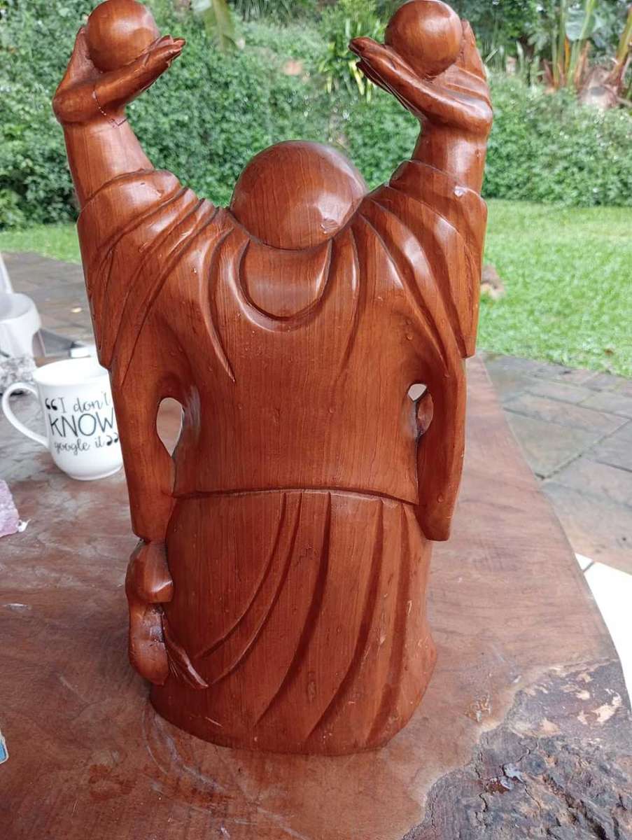 Happy wooden Buddha