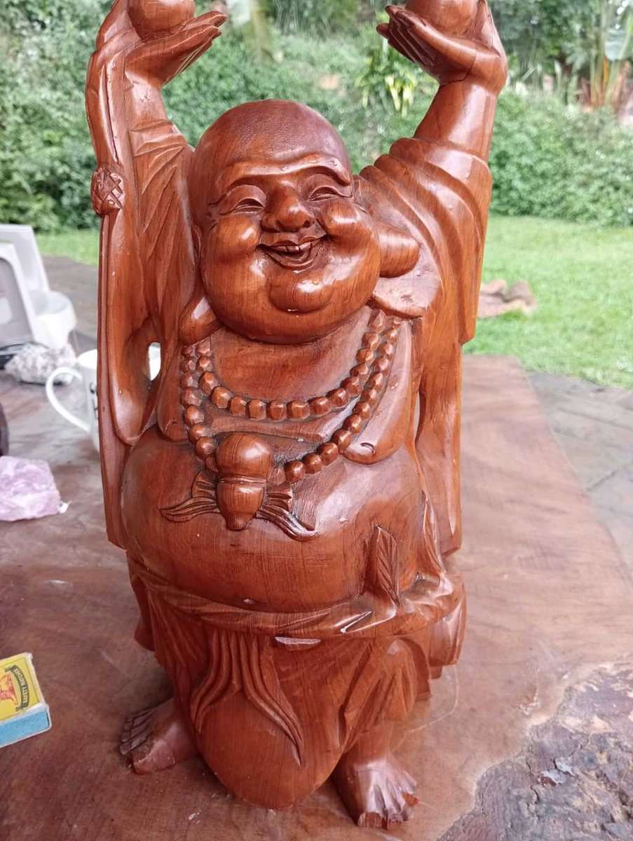Happy wooden Buddha