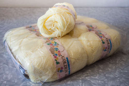 50g ball of Pinqouin baby golden age Lemon (knits like 4 ply)