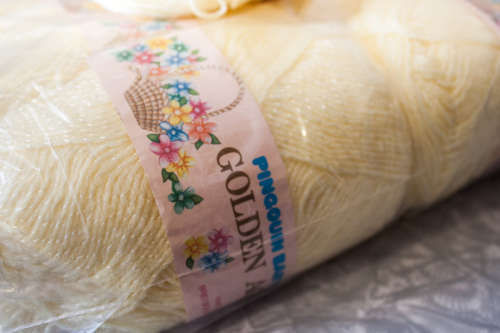 50g ball of Pinqouin baby golden age Lemon (knits like 4 ply)