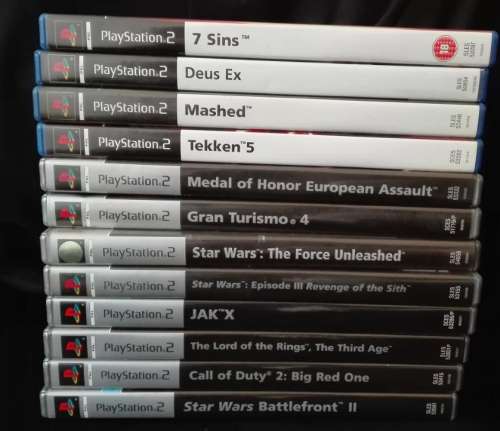 PS2 + 2 Controllers + AV Cable + Power Cable + Memory Card + 12 Games